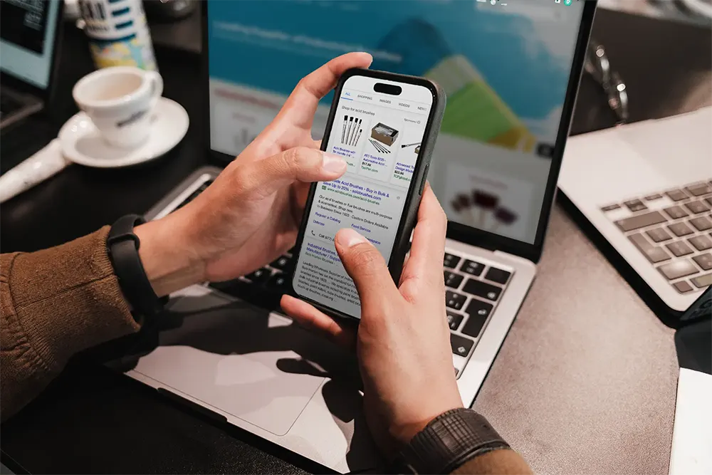 Person viewing PPC ads on their smart phone.