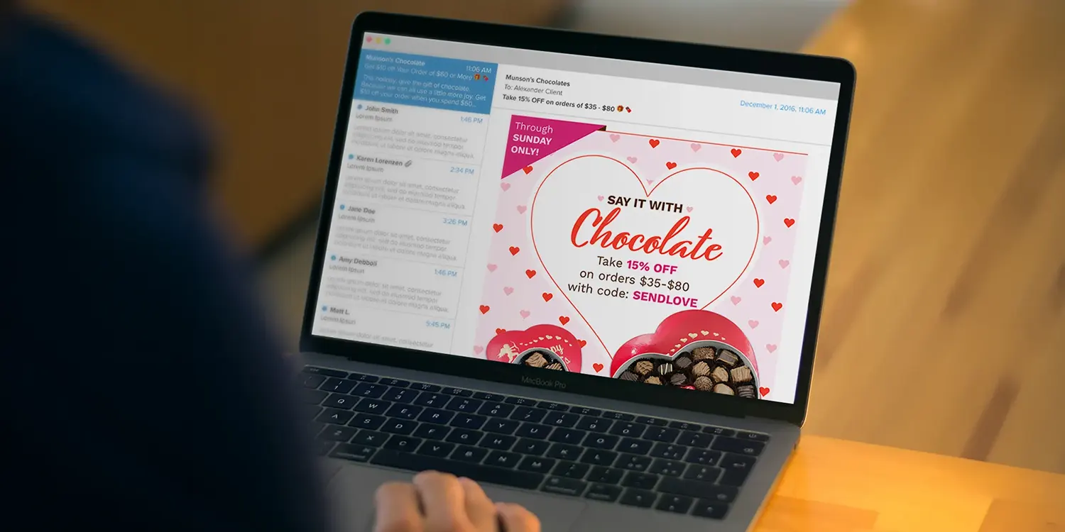 Person designing an email marketing campaign on their laptop.