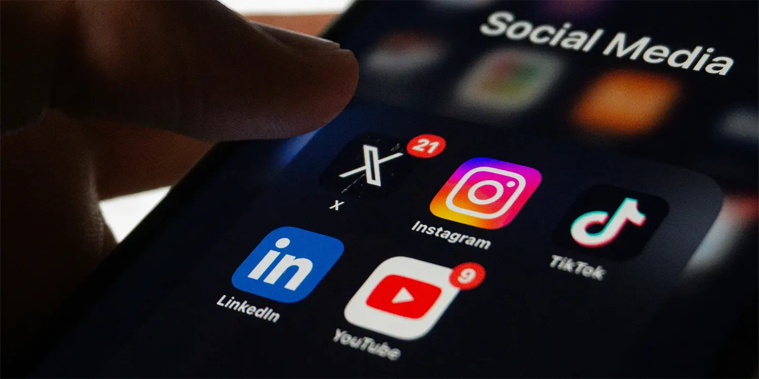 Social media icons on a smartphone.